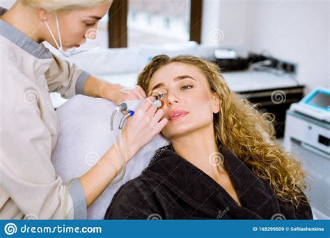 Face Skin Care Professional Female Cosmetologist Doing Hydrafacial