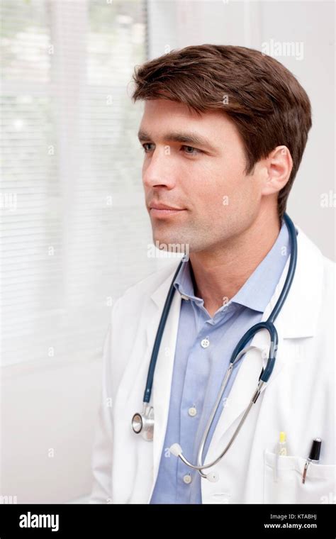 Male Doctor In Uniform Looking Away Portrait Stock Photo Alamy