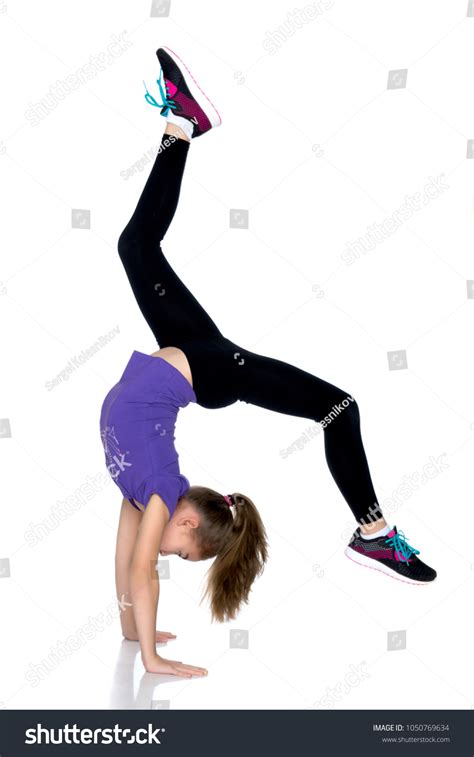 Girl Gymnast Performs Handstand Bent Legs Stock Photo 1050769634