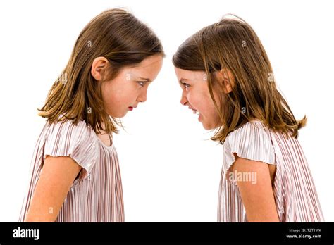 Identical Twin Girls Sisters Are Arguing Yelling At Each Other Angry