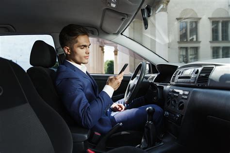 Man Checking His Phone In The Car 1486260 Stock Photo At Vecteezy