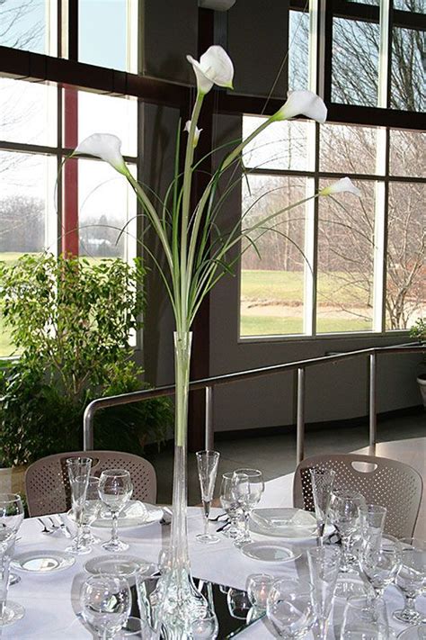 Tall calla lily centerpiece with bling wrap on vase. Calla Lillies Centerpiece idea | Calla lily centerpieces ...