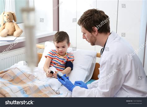 Doctor Checking Childs Blood Pressure Hospital Stock Photo 1341968462