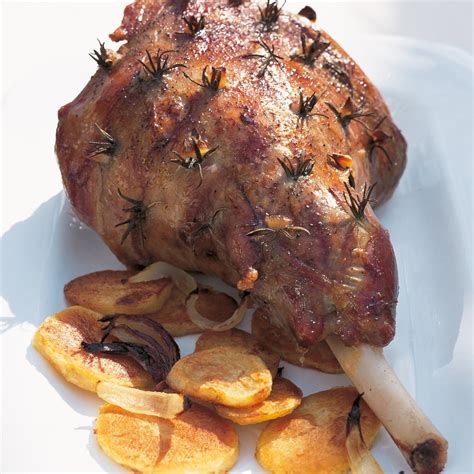 Roast Lamb With Garlic And Rosemary And Rosemary And Onion Sauce