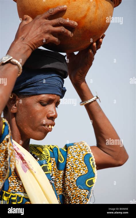 A Fulani Woman Arrives In The Town Of Djibo Burkina Faso On Foot