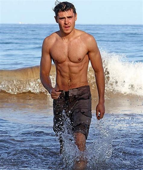 Zac Efron Reveals Toned Muscle Clad Body As He Strips Off On Beach In