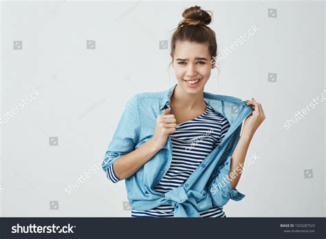 Woman Pulling Shirt Images Stock Photos And Vectors Shutterstock