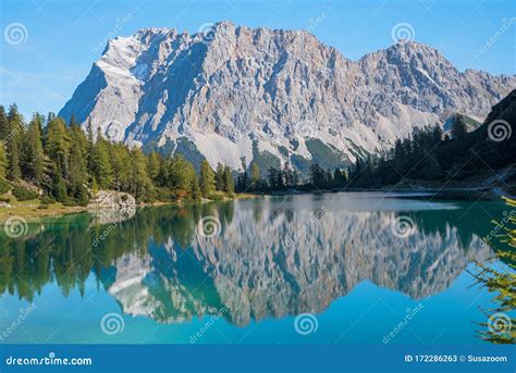 Zugspitze Mountain Mass Reflecting In The Lake Seebensee Hiking