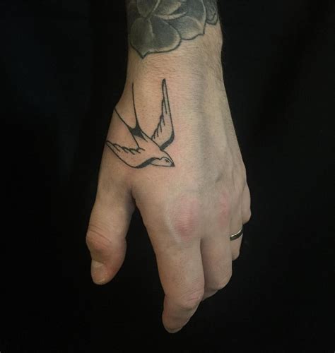 poked this swallow on garret s hand hand tattoos for guys hand tattoos small tattoos for guys