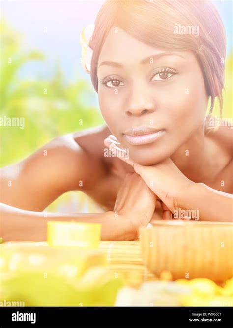 Closeup Portrait Of Pretty African Female Lying Down On Massage Table On The Beach Luxury Spa