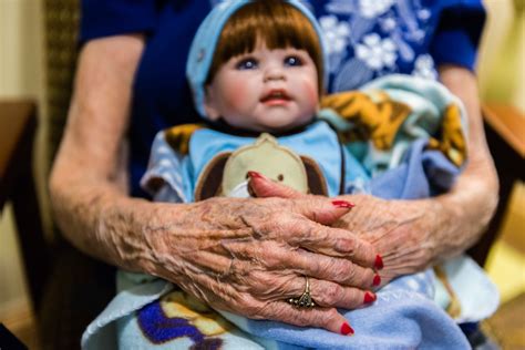 doll therapy may help calm people with dementia but it has critics npr and houston public media