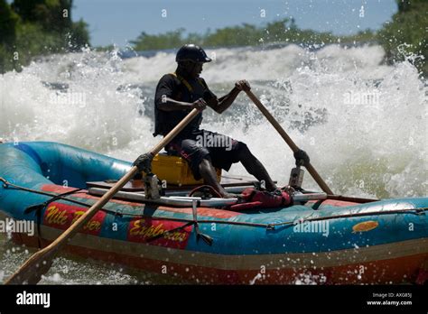 Africa Uganda Jinja Whitewater Rafter Paddles Over Bujagali Falls On