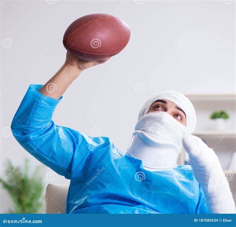 Injured American Football Player Recovering In Hospital Stock Photo