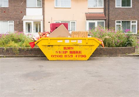 Yellow Skip In Street Full Of Rubbish Editorial Stock Image Image Of