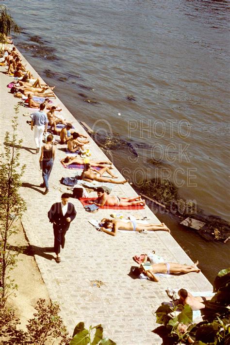 Photo Of Sunbathers On The Siene By Photo Stock Source People Paris