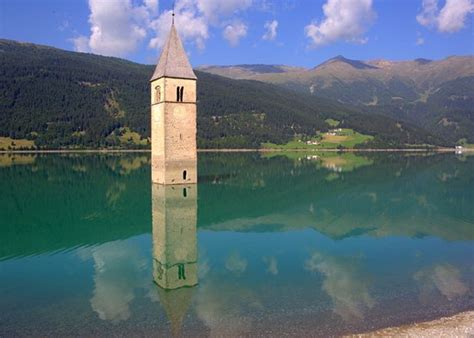 The series is set in the iconic location of curon venosta, featuring the characteristic submerged belltower. Campanile di Curon Venosta Vecchia_2017.aug. - Picture of ...