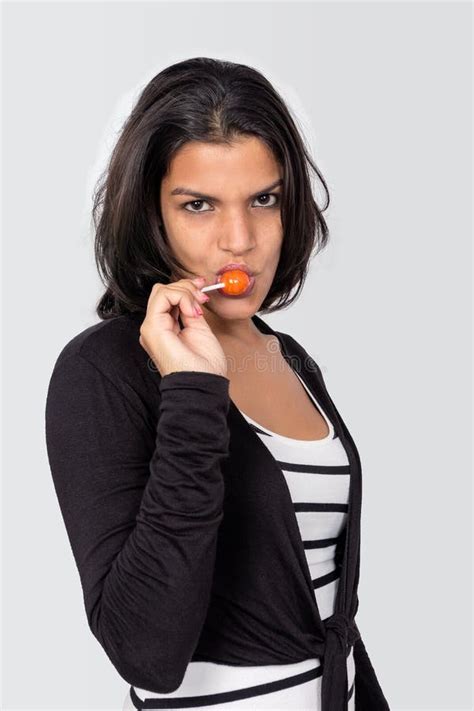 Young Black Haired Girl With A Candy Stock Image Image Of Closeup