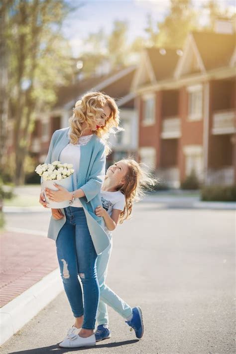 Mother And Daughter Walking On Street Stock Image Image Of Houses