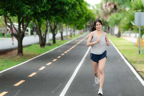 Premium Photo Asian Beautiful Woman Running At The Parkthailand Peoplethe Runners Run Training