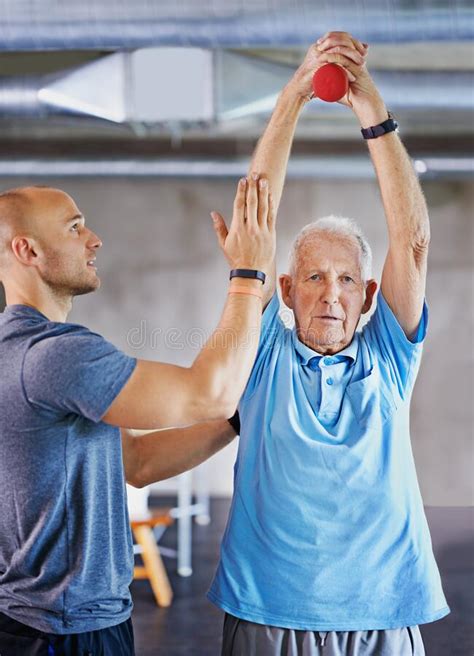 Lift For Longevity Shot Of A Senior Man Working Out With The Help Of A