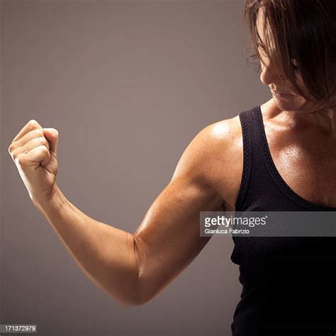 Woman Showing Bicep Photos And Premium High Res Pictures Getty Images