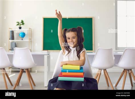 Back To School Concept Little Girl Schoolgirl With Books In Her Hands