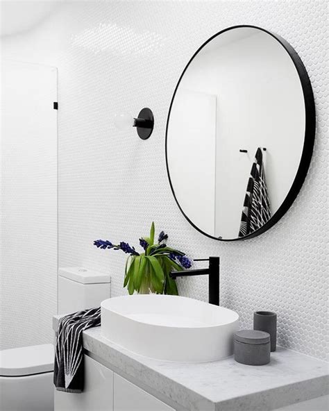 This bright bathroom comes from rita & morgan's beautiful. LOVE a round mirror