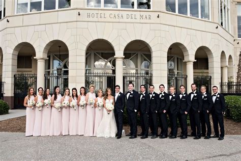 Bridesmaids And Groomsmen In Front Of Venue