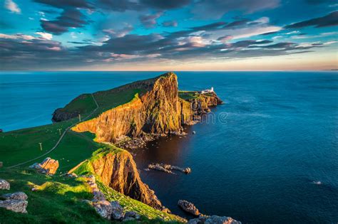 Neist Point Lighthouse And Stars In Isle Of Skye Scotland Stock Photo