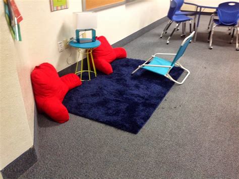 A Classroom With Chairs And Rugs On The Floor