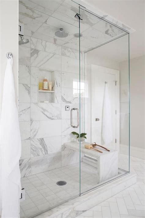 Beautifully Appointed Seamless Glass Shower Is Fitted With Marble Grid Floor Tiles Placed