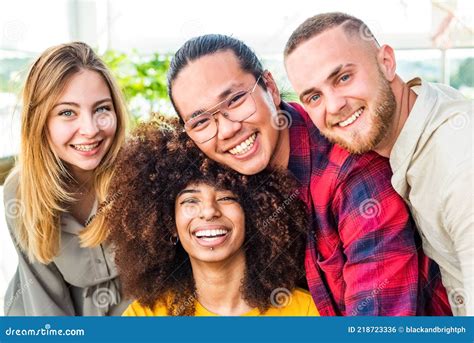 Multiethnic Group Of Friends Taking Selfie Indoor With A Curly Woman In Foregroundtwo Young