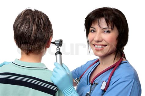 A Female Doctor Using An Otoscope To Check The Ears Of A Patient