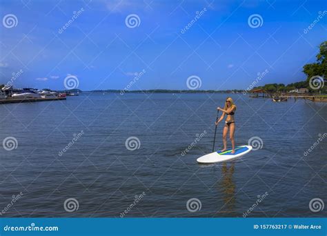 Beautiful Bikini Model Relaxing On A Paddle Board Stock Image Image