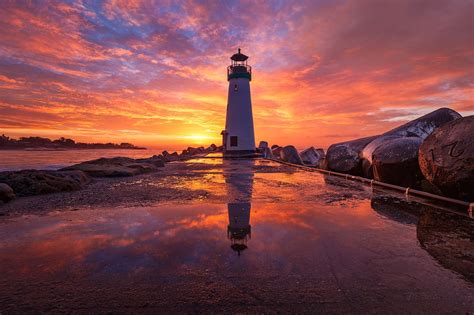Download Sky Sunrise Reflection Building Man Made Lighthouse Hd Wallpaper
