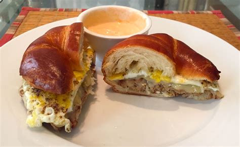 Homemade Turkey Breakfast Sausage Fried Egg And Gruyere On A Toasted Pretzel Croissant With Frank