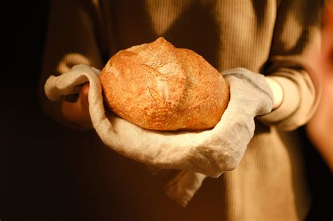 Woman Holding Loaf Of Bread Bakery Employee Holding A Freshly B Il