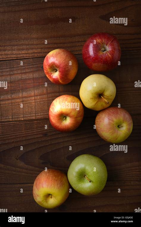 Different Varieties Of Fresh Picked Apples On A Rustic Wood Table Fuji