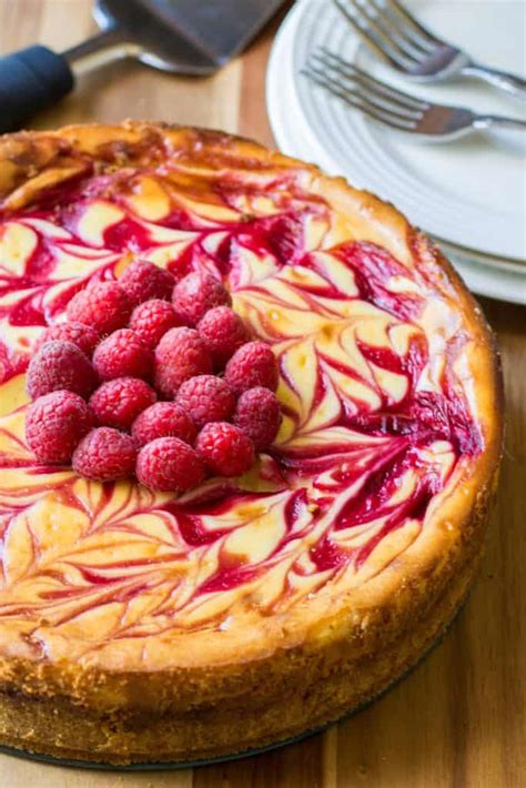 It's got a sweet raspberry swirl and an white chocolate raspberry cheesecake. White Chocolate Raspberry Cheesecake Recipe | A Wicked Whisk