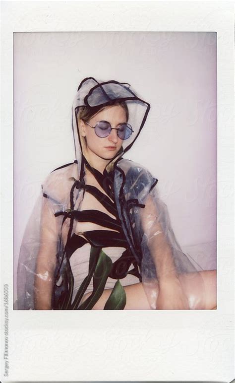 Polaroid Portrait Of Blonde Woman In Raincoat And Retro Sunglasses By