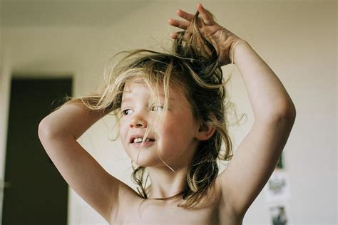 Candid Portrait Of Young Girl With Bed Head Messy Hair After Waking Up Photograph By Cavan Images