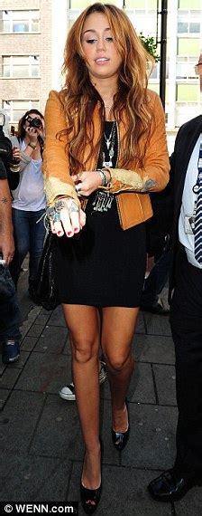 Miley Cyrus Legs It To London In A Little Black Dress As Shes Mobbed