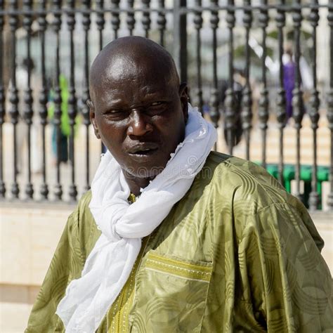 Unidentified Senegalese Man In Traditional Clothes Walks In The