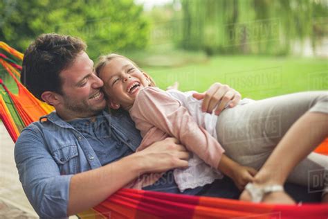 Father And Daughter Together In Hammock Stock Photo Dissolve