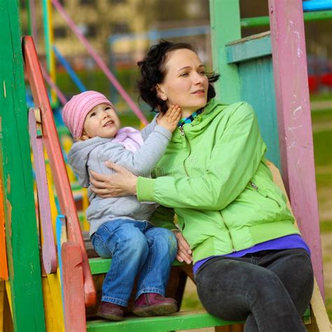 mother and daughter playing on the playground outdoors stock image image of help love 224130553