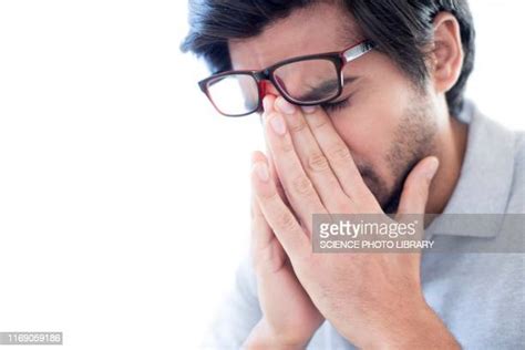 Man Pinching Bridge Of Nose Fotografías E Imágenes De Stock Getty Images