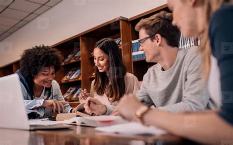 Group Of Young Students Doing Assignment Stock Photo 127762