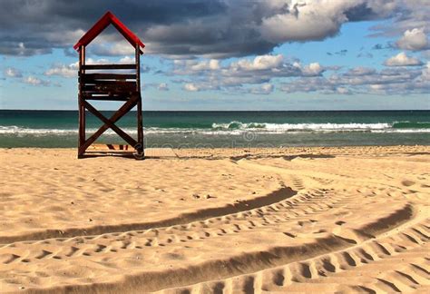 Lifeguard Stand On A Sandy Beach Next To The Ocean Stock Image Image