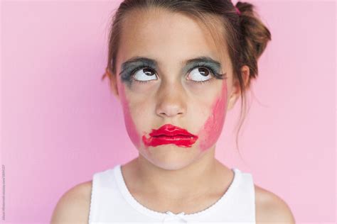 a girl who gave herself a makeover rolls her eyes del colaborador de stocksy alison