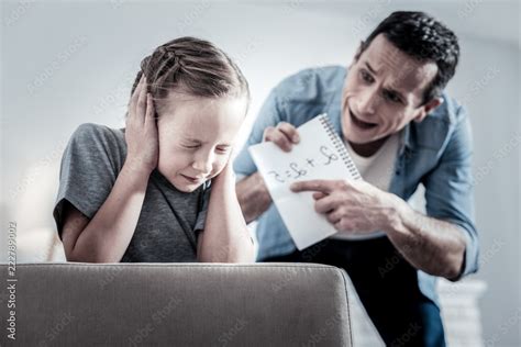 Violent Parent Inadequate Angry Father Screaming On The Daughter While Checking Her Homework